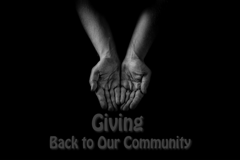 Hands being held out with the words "Giving Back to Our Community" below them