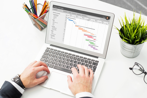 Laptop on table with data