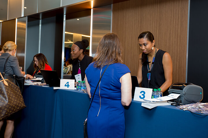 Attendees checking in at the registration desk at the WISE WWOY 2018 Luncheon