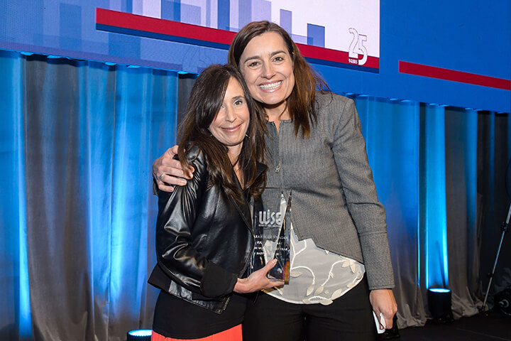 Sarah Robb O’Hagan accepting award at the WISE WWOY 2018 Luncheon