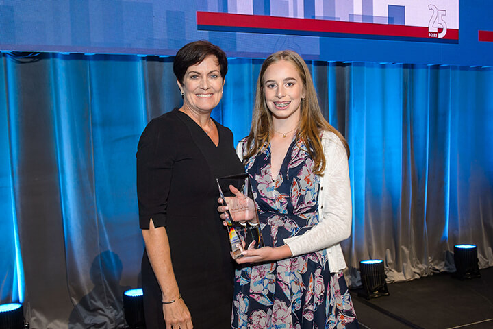 Kim Stone accepting award at the WISE WWOY 2018 Luncheon