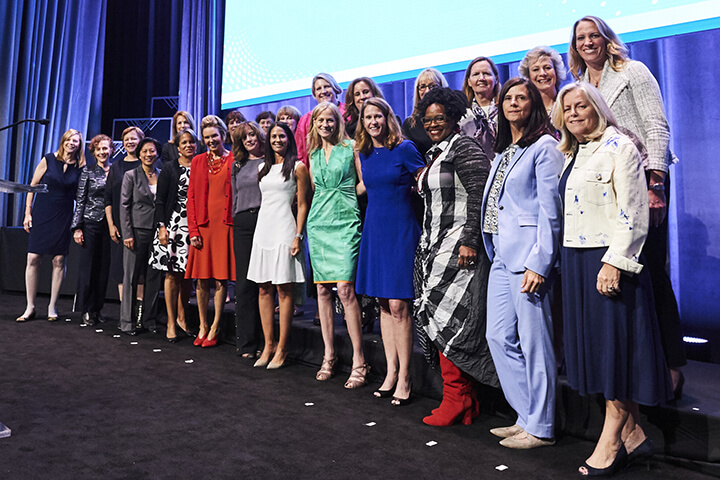 Event attendee group photo on stage at the WISE WWOY 2019 Award Luncheon