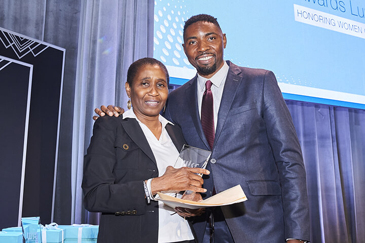 Michele A. Roberts receiving award at the WISE WWOY 2019 Award Luncheon