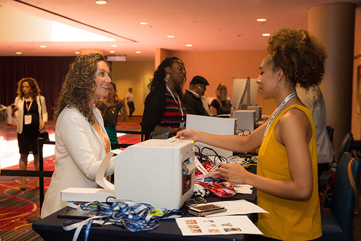 Attendee checking in a the registration desk at the 2017 WISE WWOY Luncheon