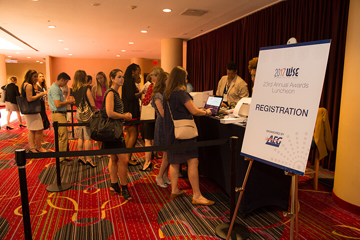 Attendees checking in a the registration desk at the 2017 WISE WWOY Luncheon
