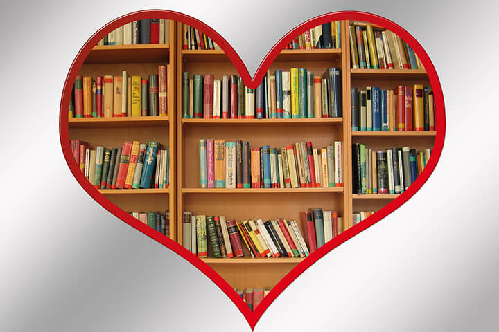 Heart overlaying an image of books on a bookshelf