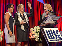 Coca-Cola representatives on stage to receive an award
