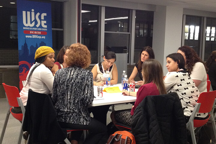 Women sitting around a table in a meeting