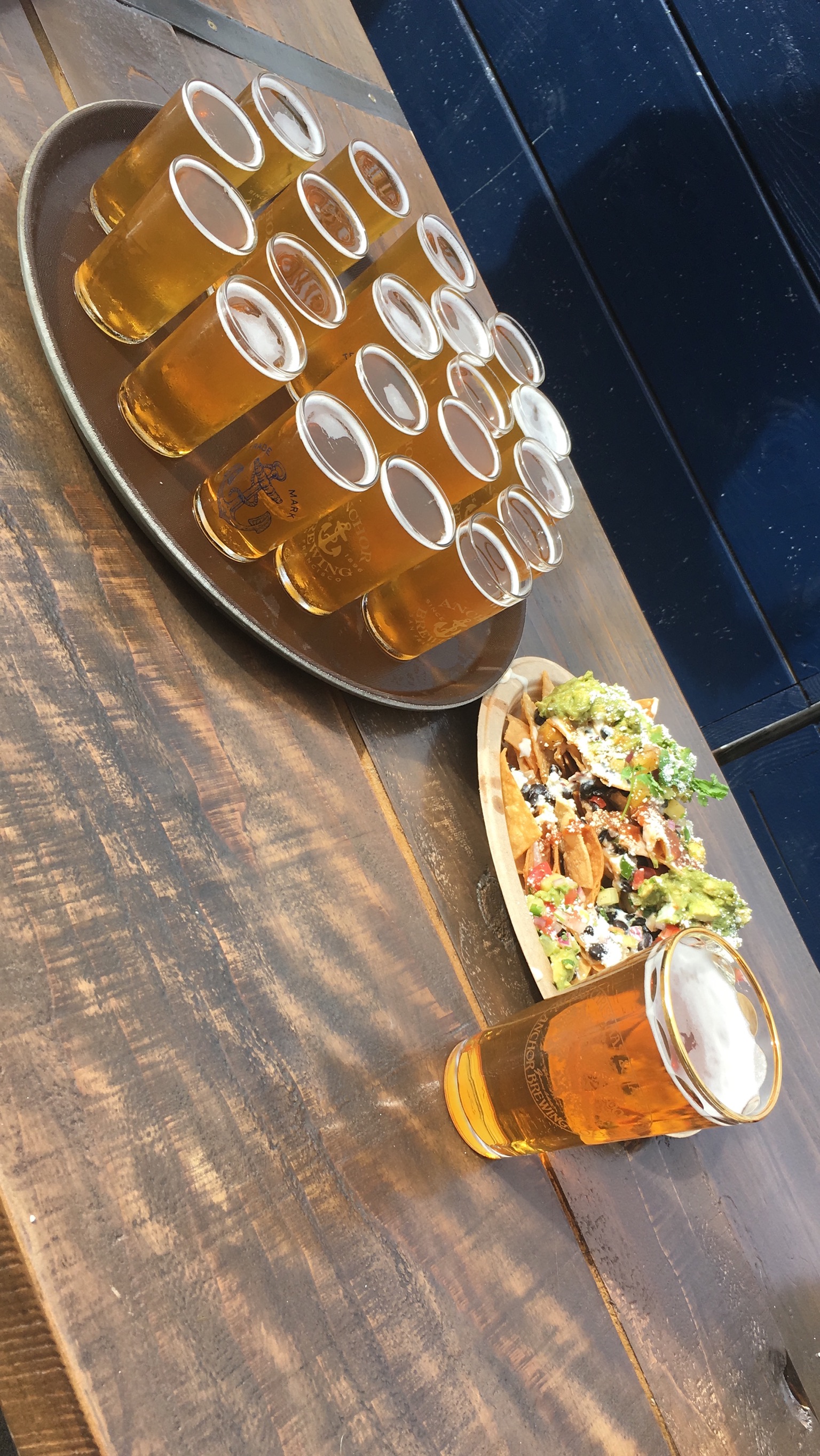 Beer glasses and a nacho platter