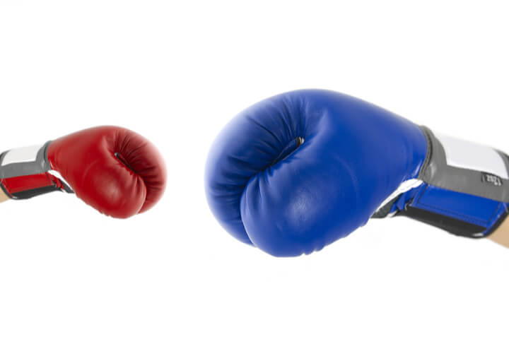 Child sized boxing glove and adult sized boxing glove