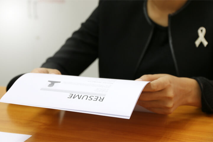 An employer looking at a resume