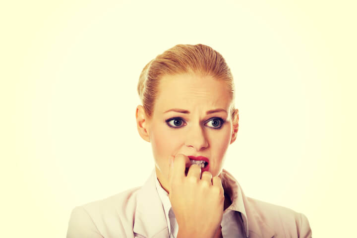 A woman looking at something very anxiously