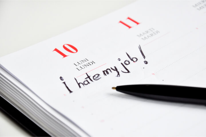 "I hate my job!" written in an agenda in pen
