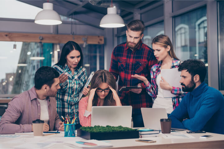 A group of coworkers all confused and frustrated while working a project together