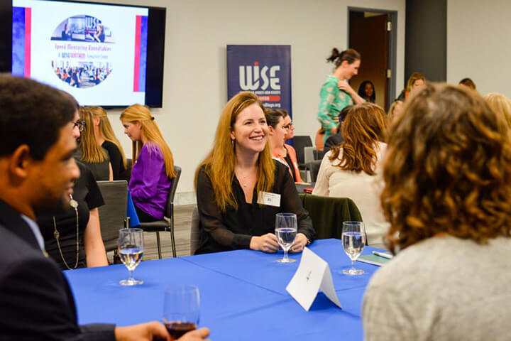 Group of participants having a discussion at a WISE event