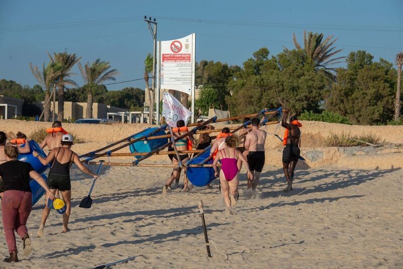 Team building exercise at Mikhmoret Beach
