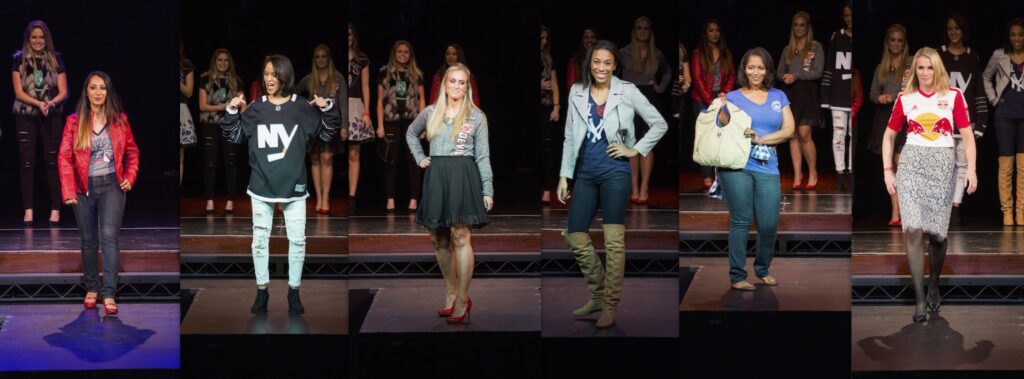 WISE NYC Metro members at 2015 Women of Inspiration event on stage modelling fashion outfits