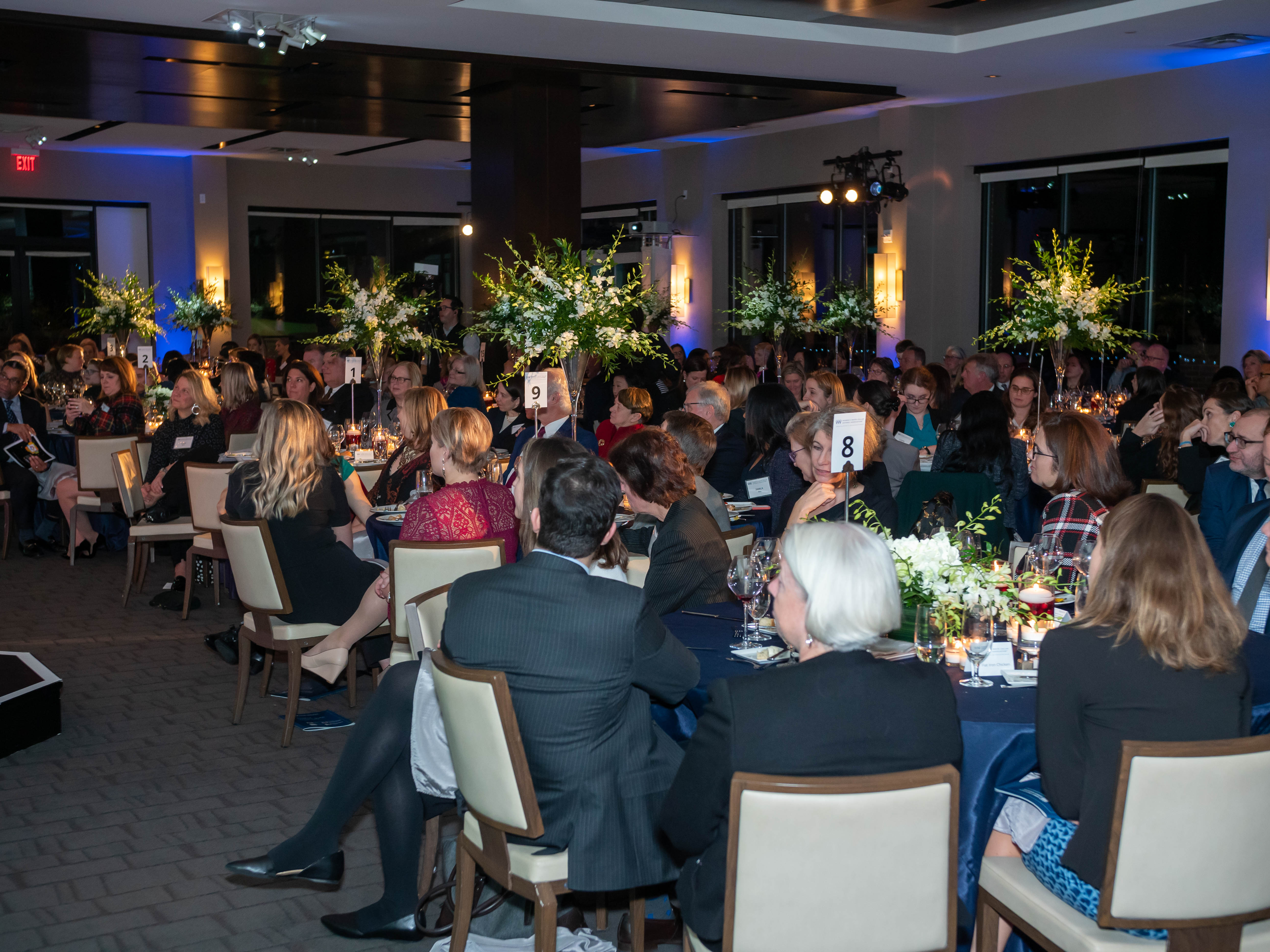 Attendees sitting at conference tables
